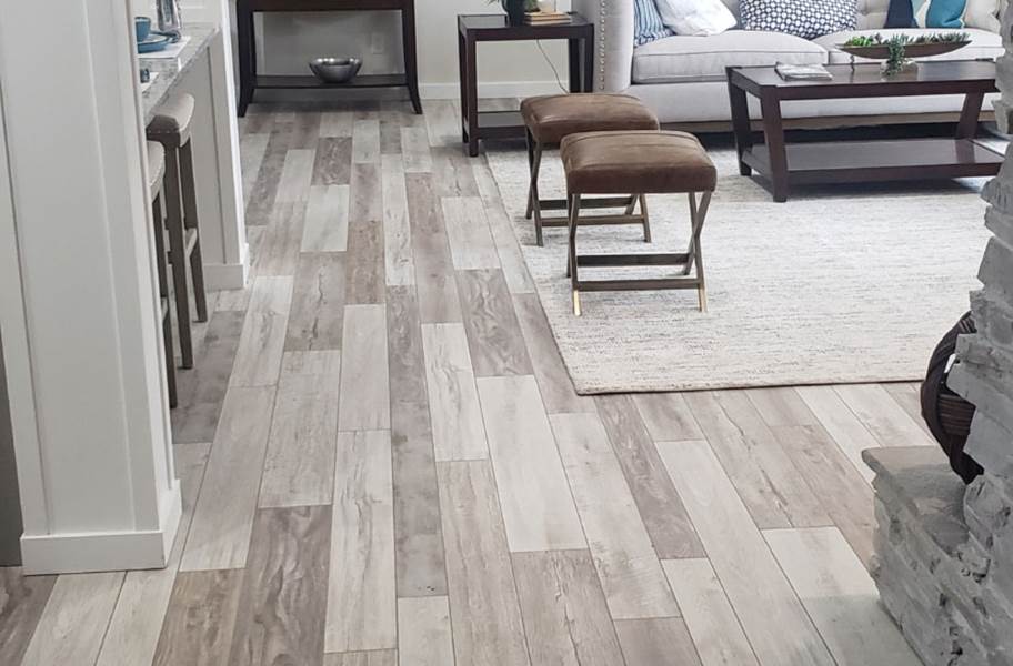 Need help finding a LVP or waterproof version that mimics the look of white  oak wood flooring stained similarly to the flooring in the pictures. A  light to medium neutral, natural wood